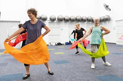 Dance class using colour scarves as a dance prop