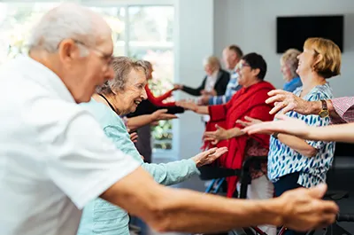 Elderly people enjoying dance session